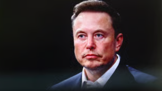 Elon Musk speaking at a Tesla event